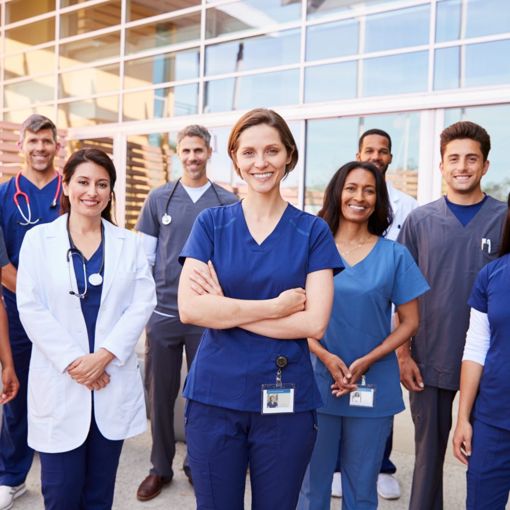 Team,Of,Healthcare,Workers,With,Id,Badges,Outside,Hospital